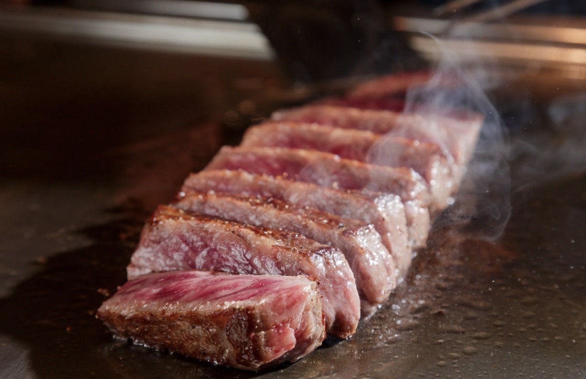 Sliced A5 heifer wagyu steak — the Queen of Wagyu — on the teppan at an Arc restaurant in Kyoto